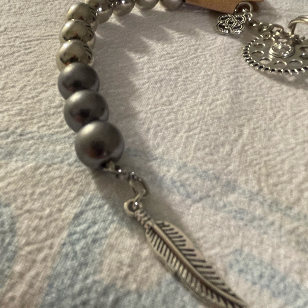Silver beaded dangle with charms